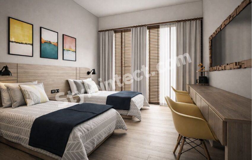 Modern Twin Bedroom Interior Design with Smart Storage and Contemporary Wooden Finishes Create a Spacious and Functional Twin Bedroom Interior with a Minimalist Modern Theme This bedroom perfectly reflects a modern bedroom interior design that balances comfort, elegance, and functionality. Designed with two single beds, the room is ideal for siblings, guest rooms, hotels, or vacation homes. Soft neutral shades, warm wooden finishes, and clean lines create a relaxing atmosphere while maximizing usable space. Every design element contributes to a clutter-free, welcoming environment that feels both stylish and practical. Elegant Color Palette, Wooden Headboard, and Stylish Wall Décor for a Premium Look The room features a calming blend of white, beige, light oak, charcoal blue, and soft grey, creating a timeless interior. A continuous wooden headboard visually connects both beds, adding warmth and sophistication. Above it, modern abstract wall art introduces subtle color without overwhelming the space. This combination is widely used in luxury bedroom interior design because it keeps the room bright, elegant, and visually balanced. Smart Storage, Wardrobe Planning, and Practical Space Optimization Although the wardrobe is not visible in this image, the layout leaves ample wall space for a floor-to-ceiling modular wardrobe with sliding or hinged shutters, making it an ideal storage solution. The long floating console on the opposite wall provides additional concealed storage while functioning as a study or dressing area. This thoughtful planning demonstrates how space-saving bedroom furniture can improve organization without making the room feel crowded. Layered Lighting and Large Windows Enhance Comfort Throughout the Day Natural daylight flows through the large glass doors fitted with wooden blinds and sheer curtains, creating a bright yet private setting. Black wall-mounted reading lights beside each bed offer focused illumination, making nighttime reading convenient. The combination of natural lighting, task lighting, and ambient lighting enhances the overall comfort and creates a warm, inviting bedroom environment. Modern Furniture Layout Improves Daily Living and Multi-Purpose Use The twin-bed arrangement ensures smooth movement while maintaining privacy for each occupant. A long wooden console with comfortable chairs serves as a work desk, study station, or vanity, making the room highly versatile. The wooden flooring visually expands the room and complements the contemporary furniture, making this a perfect example of functional bedroom interior design for modern homes. Countries Where This Bedroom Interior Design Style Is Most Popular This contemporary bedroom style is widely preferred in India, Australia, the United States, Canada, Singapore, and the United Arab Emirates. Homeowners appreciate its efficient use of space, low-maintenance finishes, modern aesthetics, and flexibility for apartments, villas, boutique hotels, and guest accommodations. Why Choose StyleIntect? At StyleIntect.com, we create customized bedroom interiors that combine beauty with everyday functionality. Our experienced designers focus on smart layouts, premium materials, and personalized solutions tailored to your lifestyle. From concept planning to final execution, we deliver interiors that are elegant, durable, and designed to maximize every inch of your space. Our Services StyleIntect provides complete design solutions, including Architecture Design, Modular Kitchen Design, Interior Design, Revit 3D Design, Bathroom Design, Wardrobe Design, Commercial Design, and 2D Layout. Whether you are renovating a single bedroom or designing an entire property, our expert team transforms your ideas into modern, practical, and visually stunning living spaces.